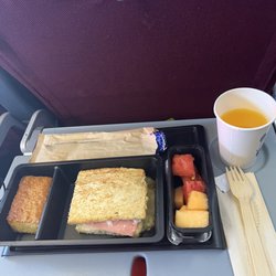 LATAM Airlines - Fruit, sweet bread, oj and ham and cheese sandwich.