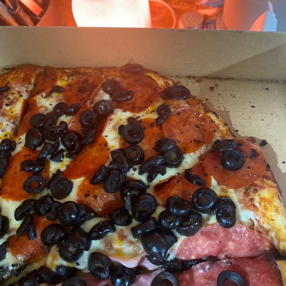 a pizza with pepperoni and olives