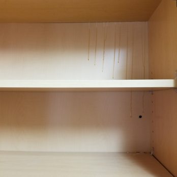 Danny's Handyman Services - Glue dripping down the back of the shelving. - Handyman Near Me - Pflugerville, Texas Danny's Handyman Services - Glue dripping down the back of the shelving. - Handyman Near Me - Pflugerville, Texas
