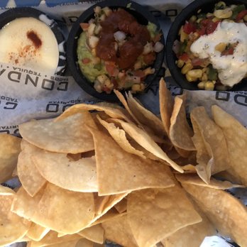 Condado Tacos - Chips corn salsa, blanco queso, and pineapple guacamole - Tex-Mex Near Me - Columbus, Ohio Condado Tacos - Chips corn salsa, blanco queso, and pineapple guacamole - Tex-Mex Near Me - Columbus, Ohio