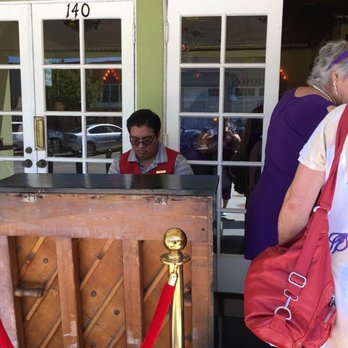 Old Town Music Hall - Piano Player outside by ticket window - Cinema Near Me - El Segundo, California Old Town Music Hall - Piano Player outside by ticket window - Cinema Near Me - El Segundo, California