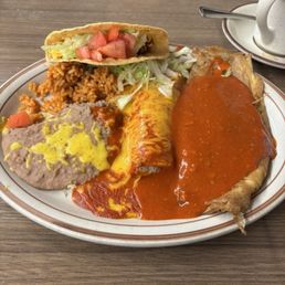 Miguel's Delight A chile relleno and a chicken enchilada smothered with green chile and cheese, served with a crispy beef taco.