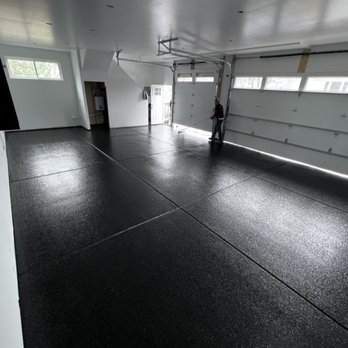 ECM Epoxy Flooring - a garage with black epoxy flooring - Flooring Near Me