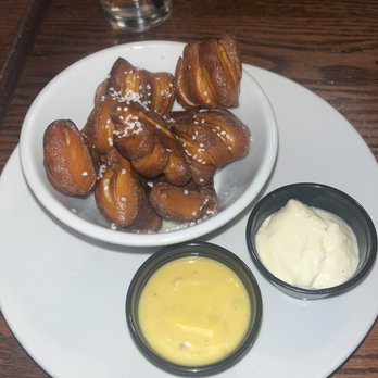 Churchill's Food & Spirits - Pretzel bites with an aioli and honey mustard - American Near Me - Flint, Michigan
