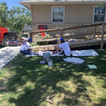 College Works Painting - Team members prepping and painting a deck on a sunny workday. - Painters Near Me - Columbus, Ohio College Works Painting - Team members prepping and painting a deck on a sunny workday. - Painters Near Me - Columbus, Ohio