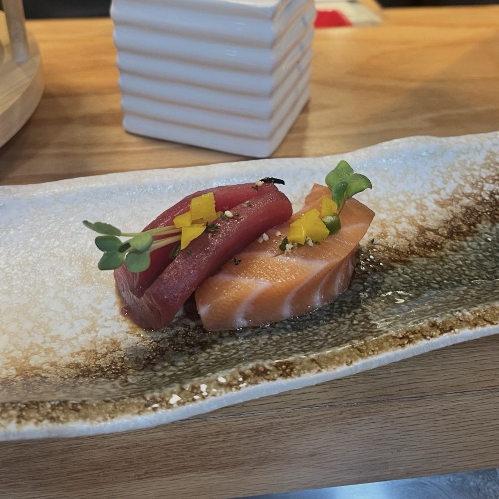 The complementary tuna and salmon sashimi The complementary tuna and salmon sashimi