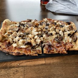 Mushroom and onion flatbread with added chicken. Mushroom and onion flatbread with added chicken.