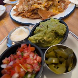 Guacamole, sour cream, jalapenos, pico de gallo for the nachos