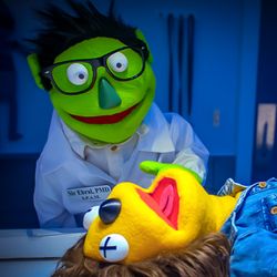 Appleseed Avenue - Sir Ebral doing a puppet autopsy. If you visit Appleseed Avenue, you might need to do one as well...