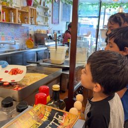 The making of strawberry, banana crepes with Nutella