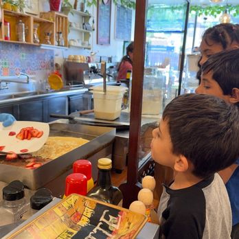 MeLatte Coffee Shop - The making of strawberry, banana crepes with Nutella - Coffee & Tea Near Me - Chicago, Illinois