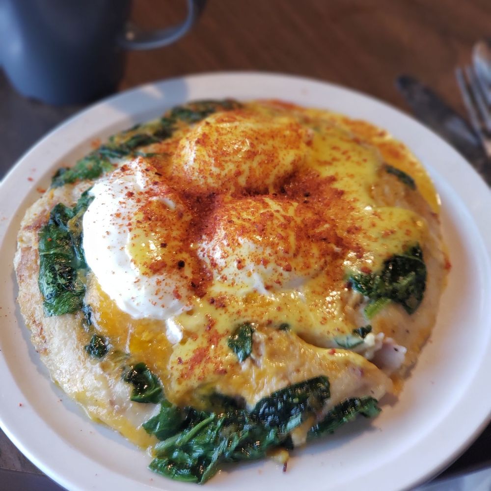 Wolfgang's Restaurant - Crab Egg Benedict Sriracha, this dish was amazing! It has real crab, non of that imitation stuff. - Breakfast & Brunch Near Me - Grand Rapids, Michigan