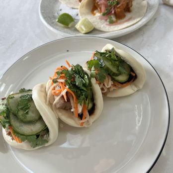 Starling - Pork steam bun and butter chicken taco - Desserts Near Me - Edina, Minnesota Starling - Pork steam bun and butter chicken taco - Desserts Near Me - Edina, Minnesota