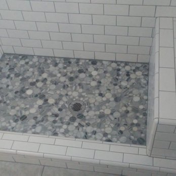 Top Notch Tile - a shower with a tiled floor - General Contractors Near Me Top Notch Tile - a shower with a tiled floor - General Contractors Near Me