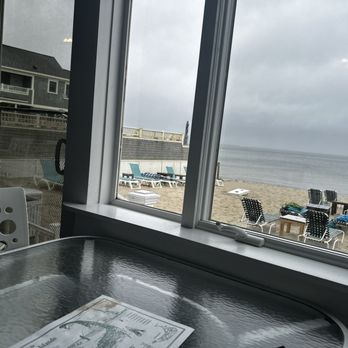 By the Sea Guests - Breakfast area looking at the beach. - Bed & Breakfast Near Me - Dennis Port, Massachusetts By the Sea Guests - Breakfast area looking at the beach. - Bed & Breakfast Near Me - Dennis Port, Massachusetts