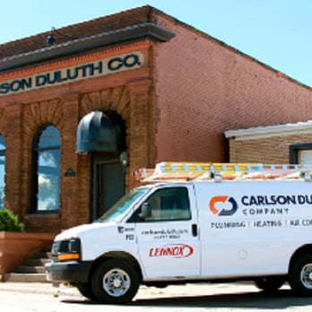Carlson Duluth Company - a van parked in front of a building - General Contractors Near Me - Duluth, Minnesota
