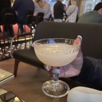 The Moderne - Woman in White Haku vodka, lychee, yuzu, orange flower water, aromatic fog bubble - Tapas/Small Plates Near Me - Orlando, Florida