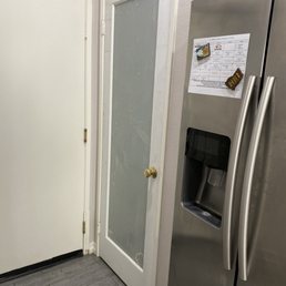 a stainless steel refrigerator in a kitchen a stainless steel refrigerator in a kitchen