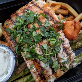 California Fish Grill - Grilled mahi mahi with half cajun and half butter garlic sauce, dynamite fries, asparagus, and a starter of fried shrimp. - Seafood Near Me - Pasadena, California California Fish Grill - Grilled mahi mahi with half cajun and half butter garlic sauce, dynamite fries, asparagus, and a starter of fried shrimp. - Seafood Near Me - Pasadena, California