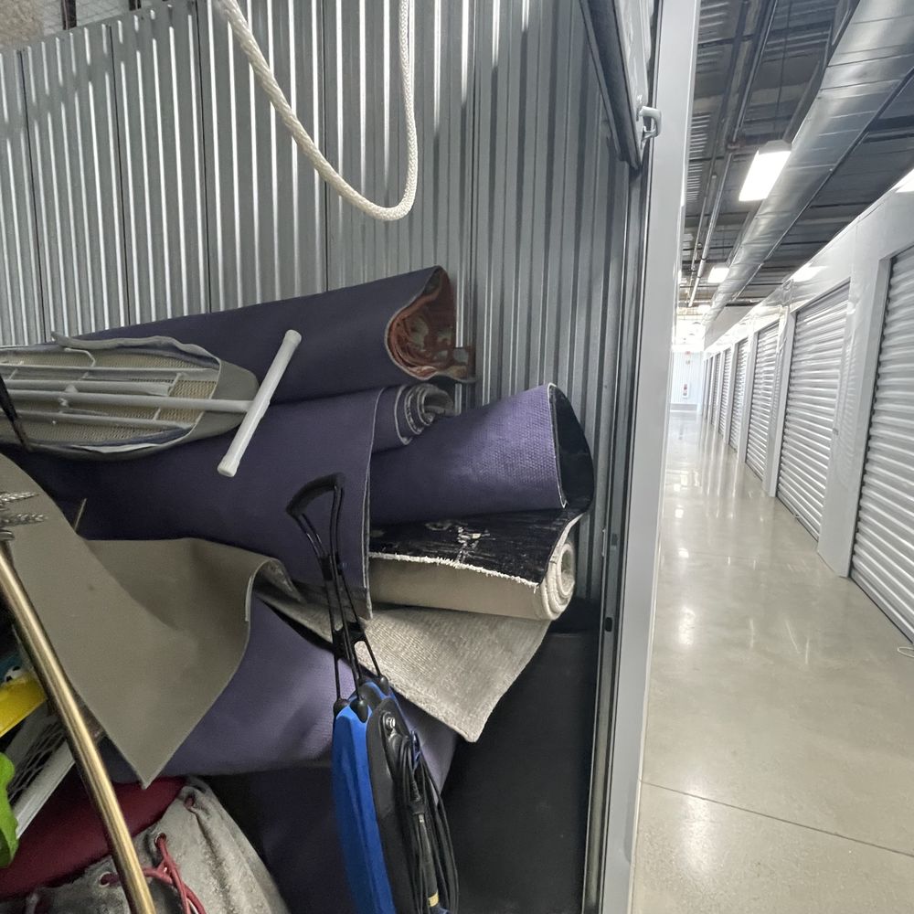 Furniture and rugs thrown into storage unit. Furniture and rugs thrown into storage unit.