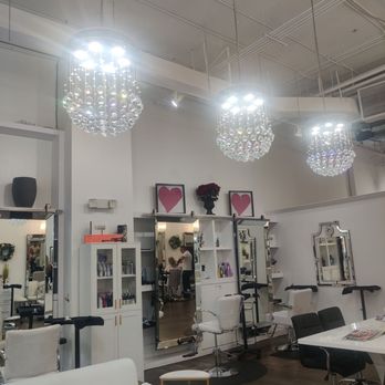 Chic Hair Studio - The chandeliers! The couches, table and chairs and snacks make it comfortable for people waiting. - Hair Extensions Near Me - Boca Raton, Florida