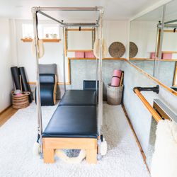 Hilltop Pilates - Classical Pilates Equipment includes full Cadillac set up.