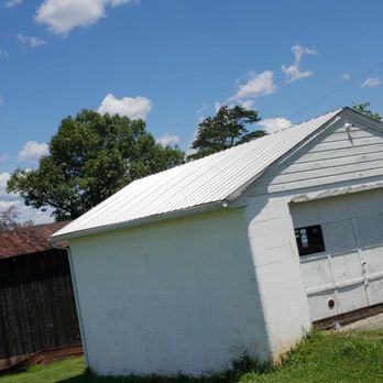 M.E. Construction - a white building with a white roof - General Contractors Near Me M.E. Construction - a white building with a white roof - General Contractors Near Me