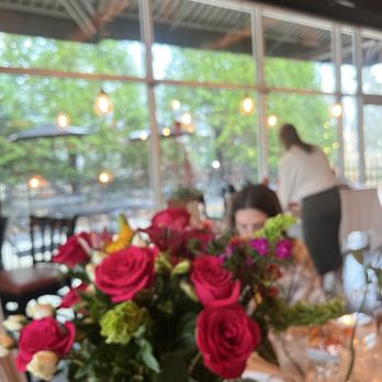 Fiorano - Nice floral arrangement and patio lights as back drop - Mediterranean Near Me - Barboursville, Virginia