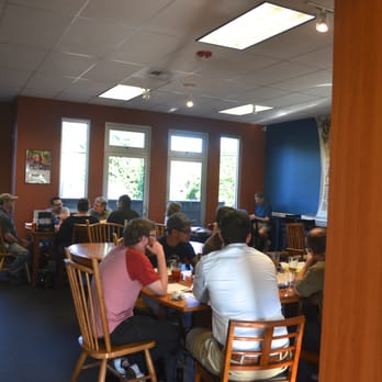 Meeples Games - people sitting at tables in a library - Hobby Shops Near Me - Seattle, Washington Meeples Games - people sitting at tables in a library - Hobby Shops Near Me - Seattle, Washington