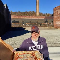 Nuzzaci Pizza Shoppee - Nuzzaci's pizza, back in the day. Pizza: Monessen style. Orbit pizza consultant Paul with full "tray" of Nuzzaci's, pittsburghorbit dot com
