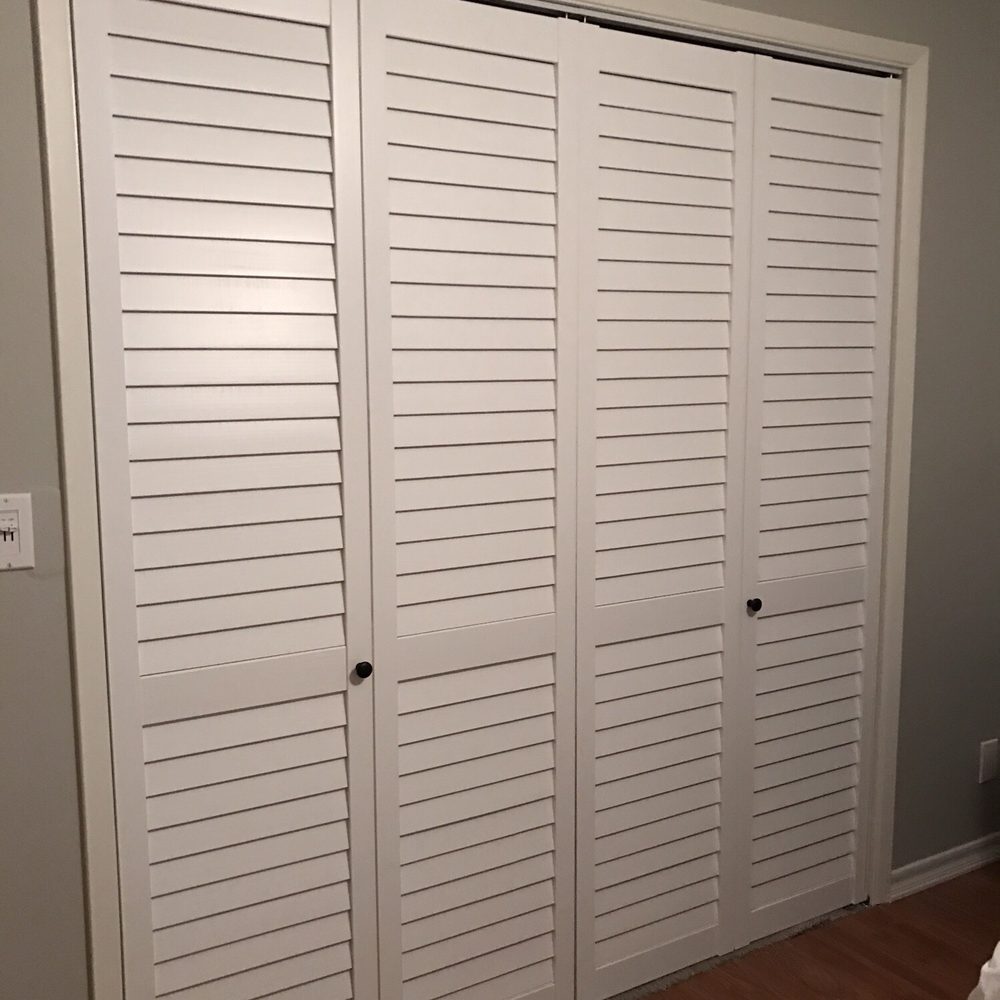 Golin Construction - a closet with white shutters - General Contractors Near Me Golin Construction - a closet with white shutters - General Contractors Near Me