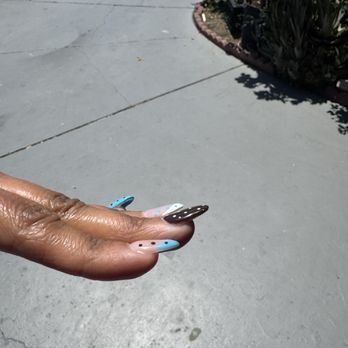 Sapphire Beauty Lounge - You can see the nail is lifted up and not straight - Nail Salons Near Me - Newark, California