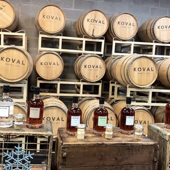 KOVAL Distillery - Bourbon Barrels and Koval's main liquor selection (with grains used in each in front of the bottles) - Distilleries Near Me - Chicago, Illinois KOVAL Distillery - Bourbon Barrels and Koval's main liquor selection (with grains used in each in front of the bottles) - Distilleries Near Me - Chicago, Illinois
