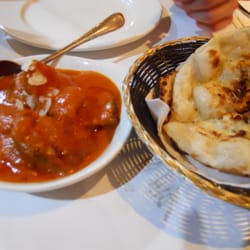 Machan Indian Restaurant - Butter Chicken: a mild dish made from boneless tandoori chicken in a creamy tomato & cashew nut sauce with Garlic Naan