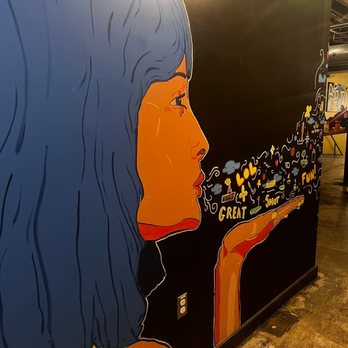 Flatstick Pub - Pioneer Square - a woman with blue hair - Mini Golf Near Me - Seattle, Washington