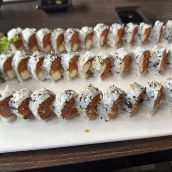 Hana - Spicy tuna roll, add cream cheese, cut small. - Sushi Bars Near Me - Gainesville, Florida Hana - Spicy tuna roll, add cream cheese, cut small. - Sushi Bars Near Me - Gainesville, Florida