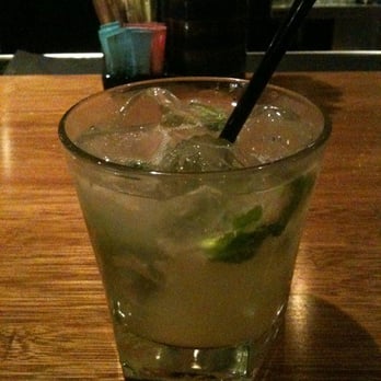 Malai Kitchen - Pomelo Mojito with some sips taken out - Thai Near Me - Dallas, Texas