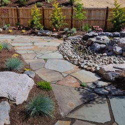 Arne Jensen Landscaping - Flag stone pathways make a great addition to your space.