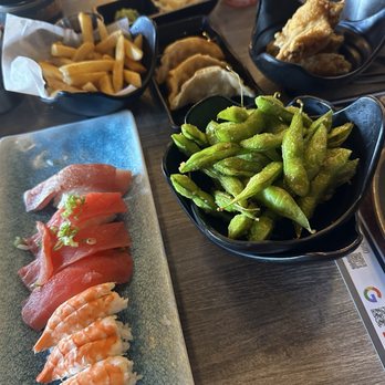Sushi Tsunami - Tuna and Ebi nigiri, garlic edamame, gyoza, fries and fried chicken wings - Sushi Bars Near Me - Pleasant Hill, California Sushi Tsunami - Tuna and Ebi nigiri, garlic edamame, gyoza, fries and fried chicken wings - Sushi Bars Near Me - Pleasant Hill, California