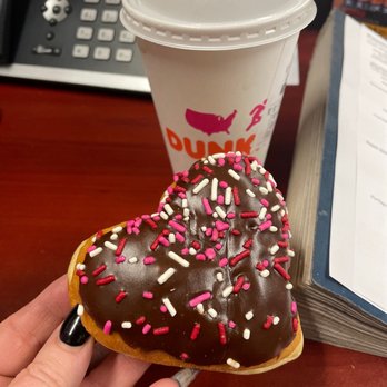 Dunkin' -  a chocolate donut with sprinkles and a cup of coffee - Coffee & Tea Near Me - Avon, Indiana