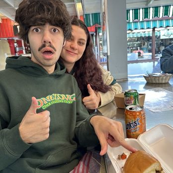 Phil's Deli & Grill - Two lovers munching - Delis Near Me - Los Angeles, California