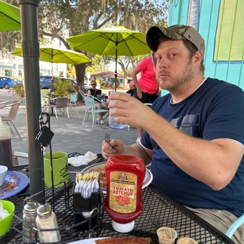 Stella's - Amazing breakfast on the patio, here's my buddy stuffing his face! - Delis Near Me - Gulfport, Florida Stella's - Amazing breakfast on the patio, here's my buddy stuffing his face! - Delis Near Me - Gulfport, Florida