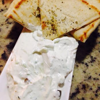 Poseidon - Tzatziki (Greek yogurt, cucumber, garlic & capers) with house made pita. - Greek Near Me - Miami Beach, Florida Poseidon - Tzatziki (Greek yogurt, cucumber, garlic & capers) with house made pita. - Greek Near Me - Miami Beach, Florida