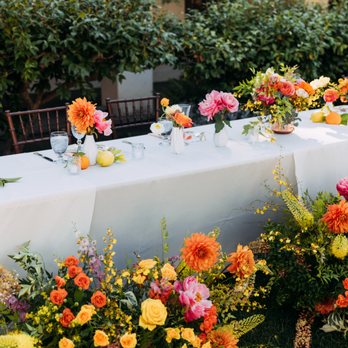 Flowerstory - Head table decor (repurposed from ceremony)  Photo by: Trevor and Elisebeth (@trevorandelisebeth) - Florists Near Me