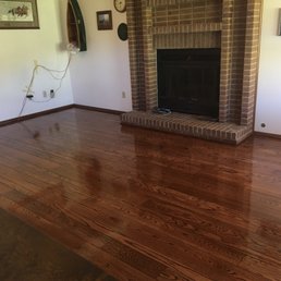 a hardwood floor in a living room a hardwood floor in a living room
