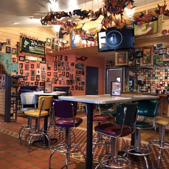Chuy's - Bar area with happy hour posted. - Mexican Near Me - Greenville, South Carolina