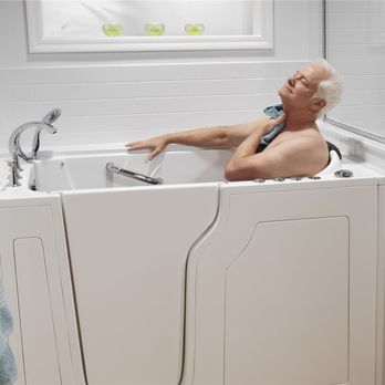 BathNow - an older man taking a bath in a bathtub - General Contractors Near Me BathNow - an older man taking a bath in a bathtub - General Contractors Near Me