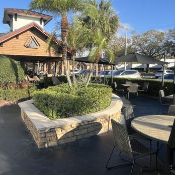 Grillsmith - Carrollwood - Outdoior dining up front... and back under that brown roof with the Grillsmith logo in back. February 2026 - Steakhouses Near Me - Tampa, Florida Grillsmith - Carrollwood - Outdoior dining up front... and back under that brown roof with the Grillsmith logo in back. February 2026 - Steakhouses Near Me - Tampa, Florida