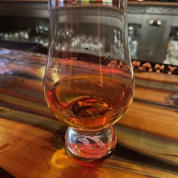 Savoy Taproom - a glass of whiskey sitting on a bar - Cocktail Bars Near Me - Albany, New York Savoy Taproom - a glass of whiskey sitting on a bar - Cocktail Bars Near Me - Albany, New York