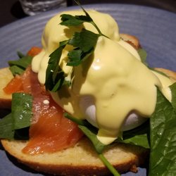 The Coffee Club - Eggs benedict with smoked salmon and spinach on ciabatta bread